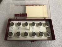 A box of aluminum stubs with mounted conodonts for SEM.